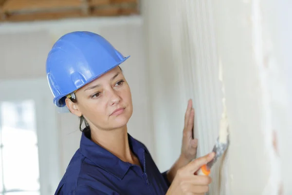 Woman Removing Wall Paper — Stock Photo, Image