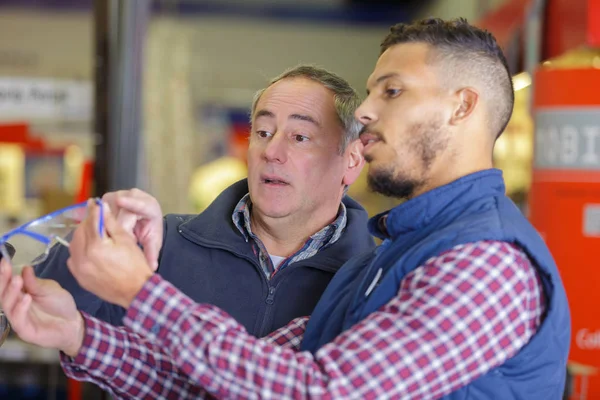 Customer and seller at harware store Stock Photo by ©photography33