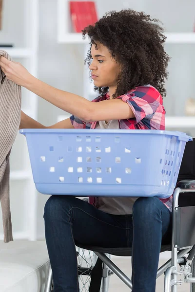 Woman Wheelchair Putting Towels Washing Machine — Stock Photo, Image