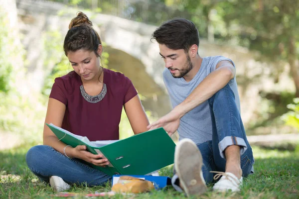 Couple Students Sitting Grass Reading Book — Stock Photo, Image
