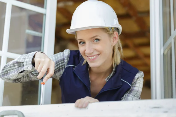 Happy Woman Fixing Old Wooden White Window Panel — Stock Photo, Image