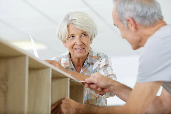 Happy Senior Checking Furnitures — Stock Photo, Image