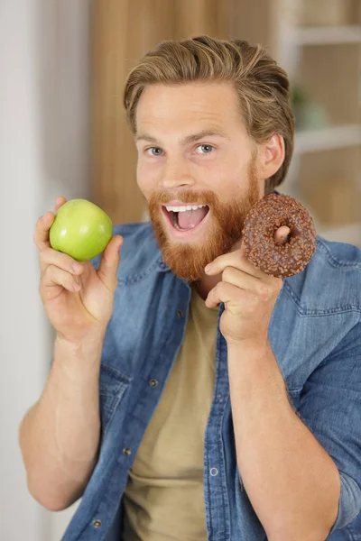 Animerad Man Som Håller Äpple Och Munk — Stockfoto