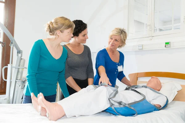 medical team learning to use a hoist