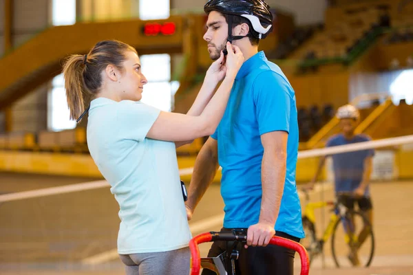 Female Coach Strapping Bikers Helmet — Stock Photo, Image