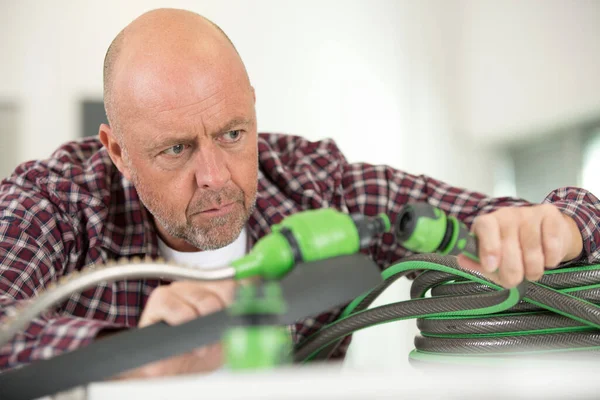 Male Technician Repairing Pipes Indoors — Stock Photo, Image