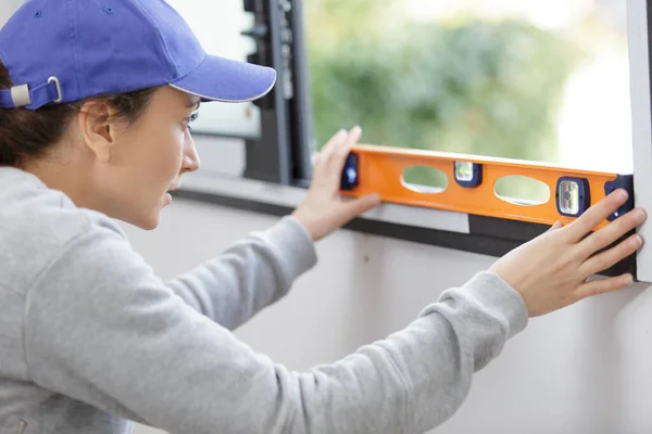 Rear View Young Woman Measuring Window Tape Measurer — Stock Photo, Image