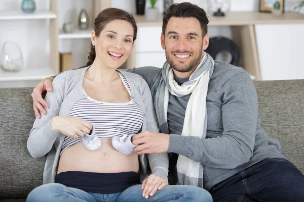 Husband Pregnant Woman Holding Baby Shoes — Stock Photo, Image