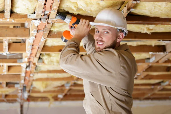 Tradesman Using Drill Wooden Framework Ceiling — Stock Photo, Image