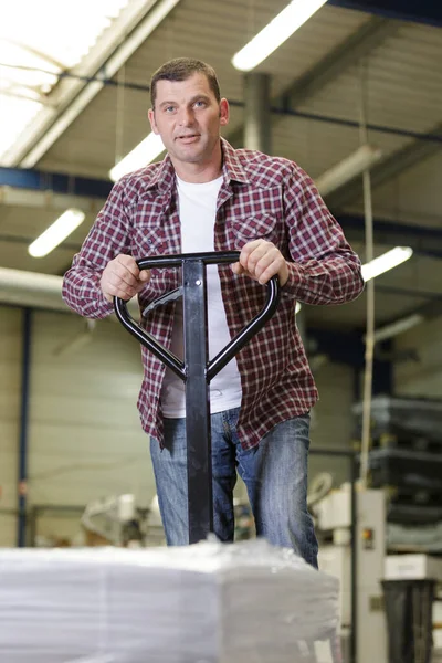 Man Carrys Goods Warehouse — Stock Photo, Image