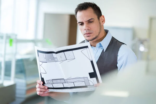 Man Looking House Construction Plan Indoors — Stock Photo, Image