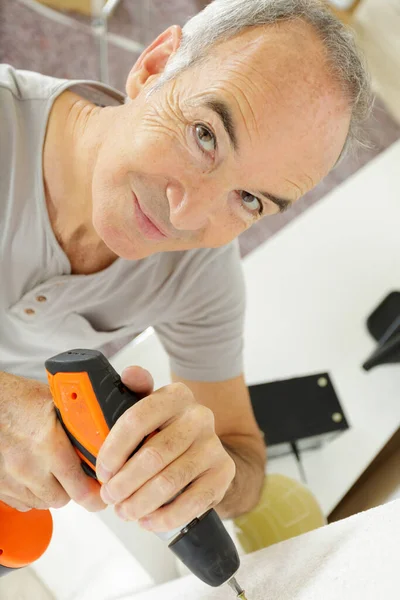 Senior Man Drilling Hole Wall — Stock Photo, Image