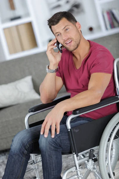 Handsome Man Wheelchair Talking His Phone Smiles — Stock Photo, Image