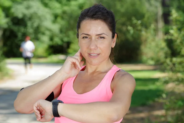 Female Runner Looking Her Sport Watch — Stock Photo, Image