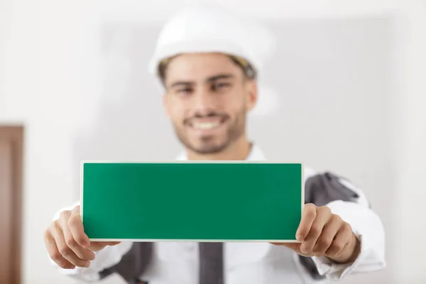 Man Holding Wet Paint Sign — Stock Photo, Image