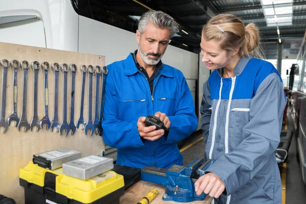 man and woman in tools workshop