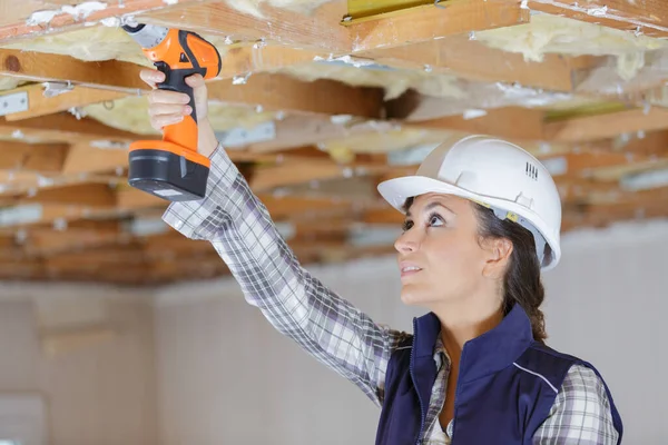 Female Contractor Using Drill Site — Stock Photo, Image