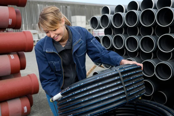 Hardworking Woman Checking Pipes — Stock Photo, Image