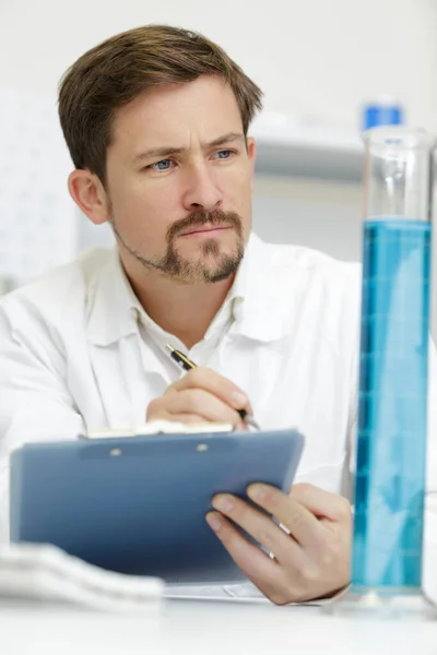 Man Checking Liquids Lab — Stock Photo, Image