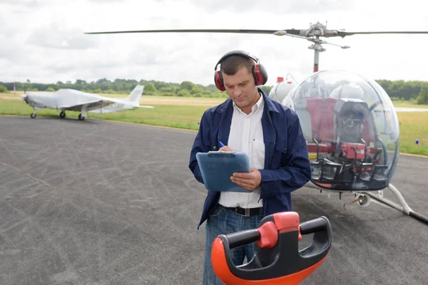 Helicopter Technician Writing Clipboard — Stock Photo, Image