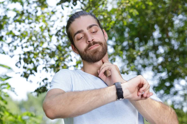 Male Runner Checking Pulse His Neck — Stock Photo, Image