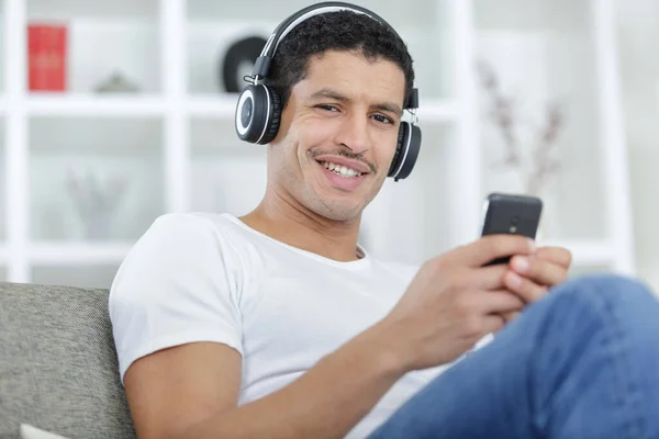 Smiling Young Man Headphones Home — Stock Photo, Image