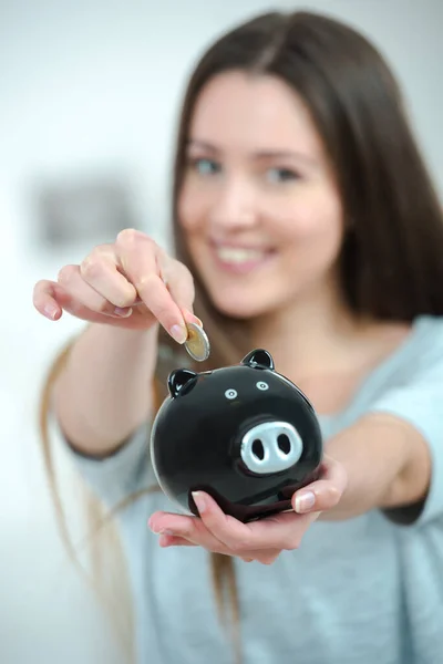Pretty Young Woman Using Piggy Bank — Stock Photo, Image
