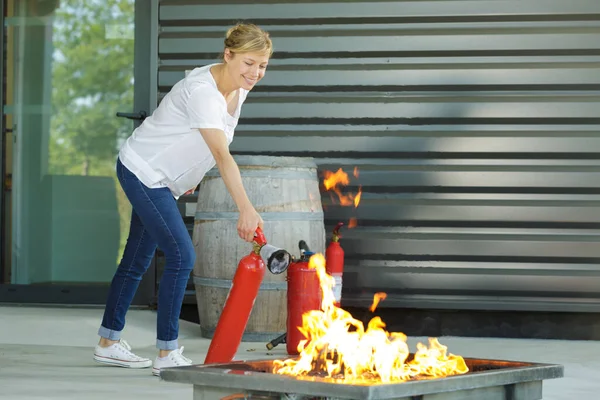 Excited Young Blonde Woman Fire Extinguisher — Stock Photo, Image