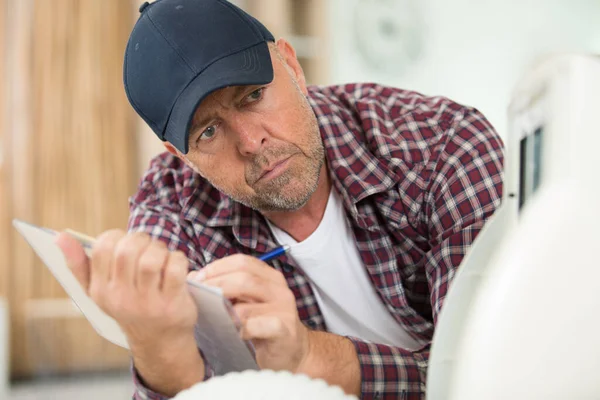 Senior Inspector Checking Appliance — Stock Photo, Image