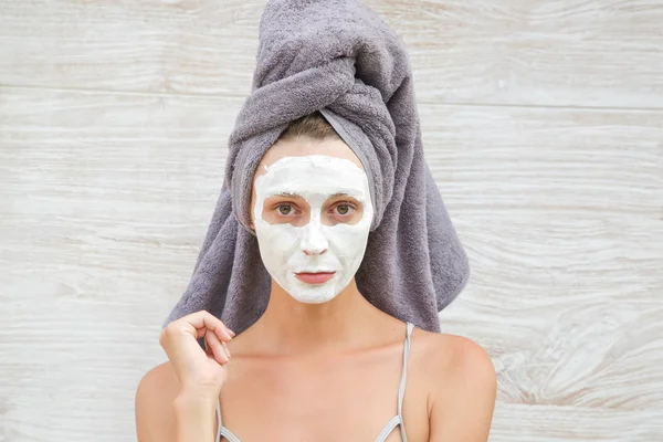 Portrait of a woman with beauty mask on her face