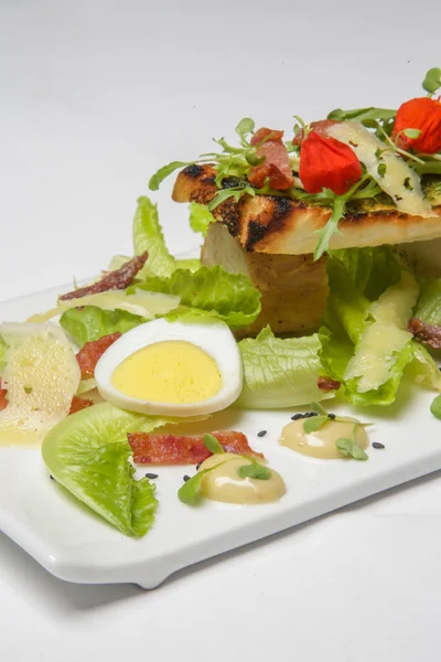 Chicken Caesar salad. Exquisite dish. Creative restaurant meal concept.