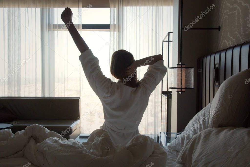 Upper body mobility, Beautiful young woman stretching on bed after waking up