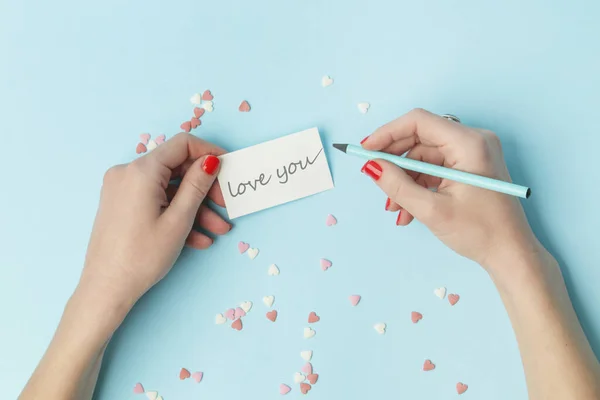 Top View Female Writing Love You Note Blue Background Ημέρα — Φωτογραφία Αρχείου