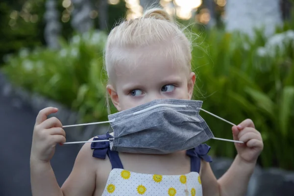 Little Toddler Girl Trying Put Medical Protective Mask Candid Outdoor — Stock Photo, Image