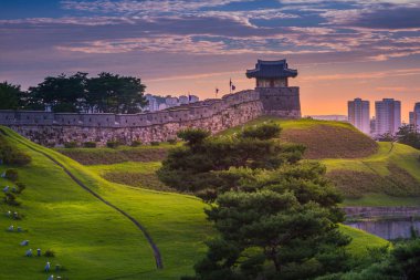 Hwaseong Fortress in Sunset, Traditional Architecture of Korea a clipart