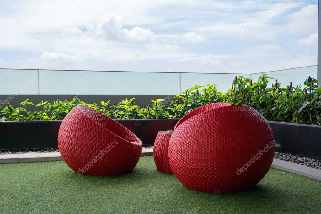 Red Rattan Arm Chair at Coister of Condiminium