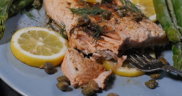A delicious roasted organic salmon with capers and dill Stock Picture