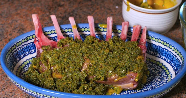 A rack of lamb coated with mustard and breaded mint Stock Photo