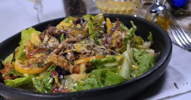 Dolly panning view of a Caesar's salad — Stock Video