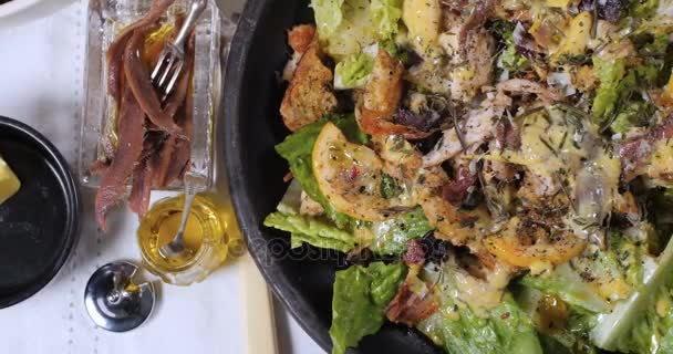 Dolly top down close up view of a Caesar's salad — Stock Video