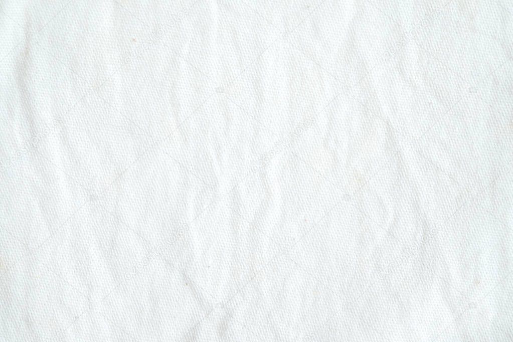 Wrinkled white cotton fabric texture background, wallpaper