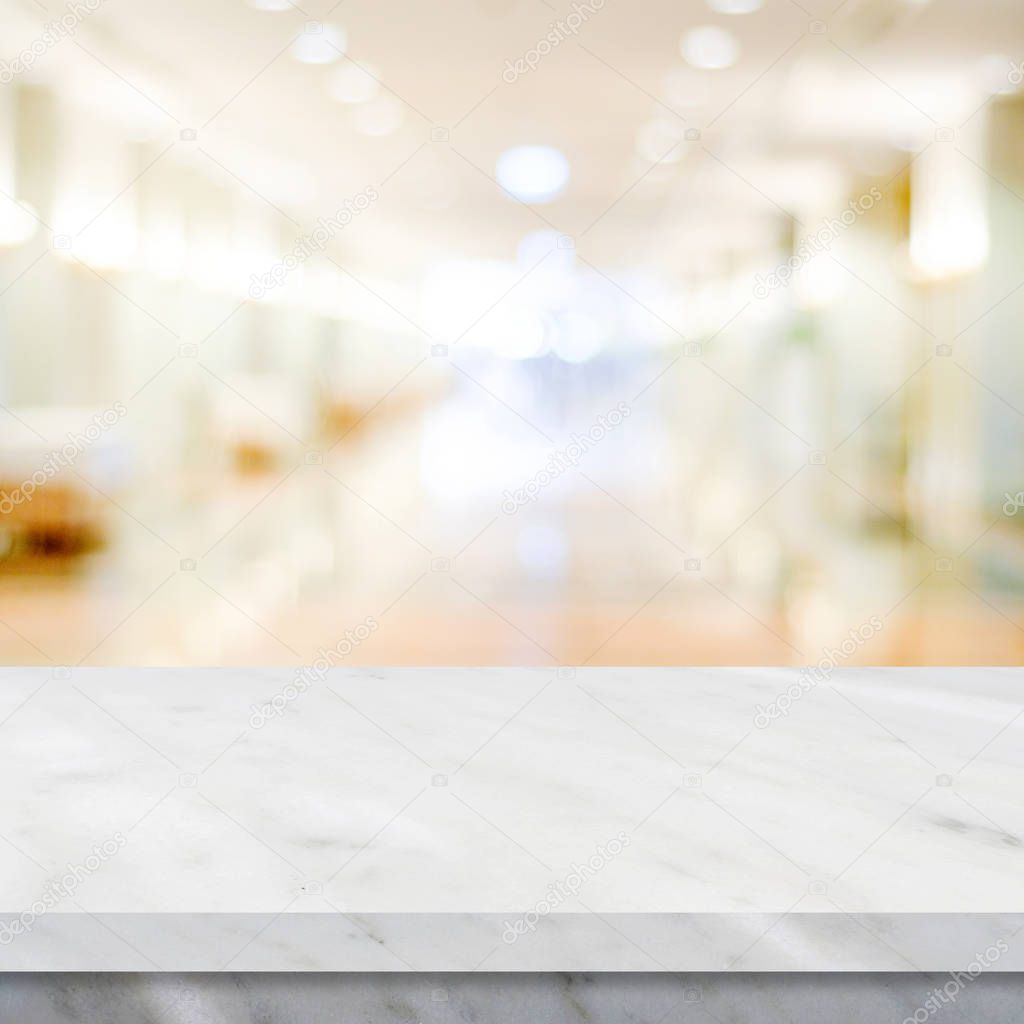 Empty white marble over blur store background, product display m