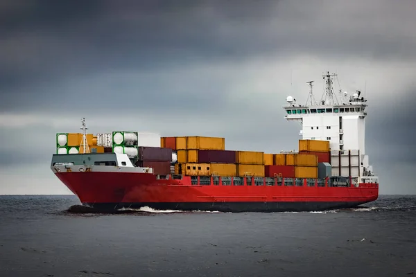 Red cargo container ship