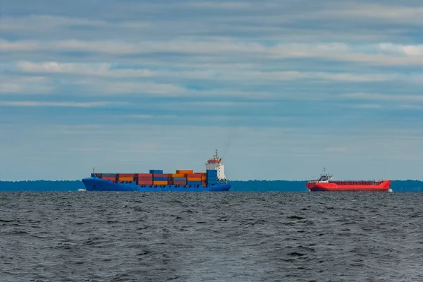 Red and blue cargo ship
