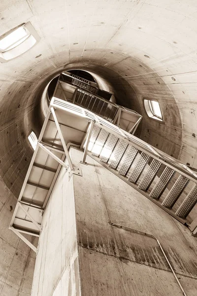 Emergency staircase around elevator shaft