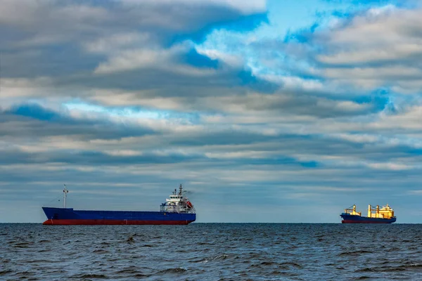 Blue cargo ships moored — Stock Photo, Image