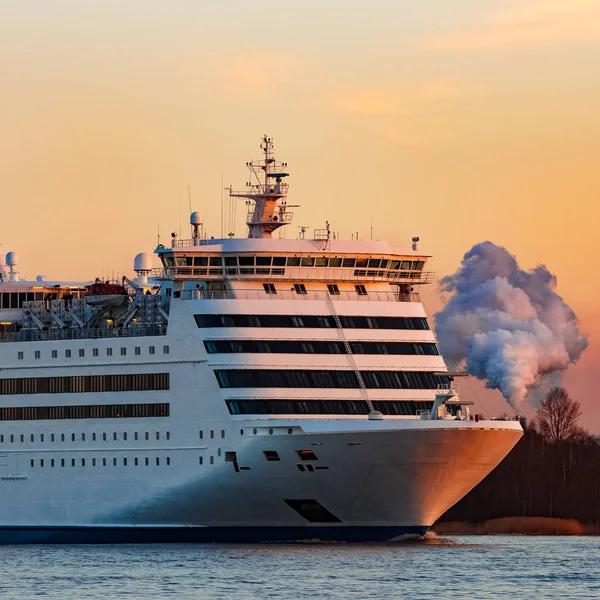 White cruise liner at sunset
