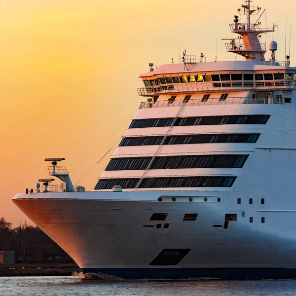 White cruise liner at sunset
