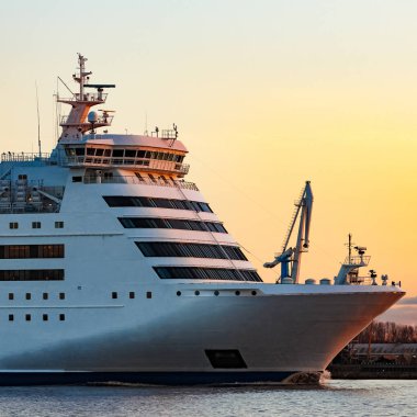White cruise liner at sunset
