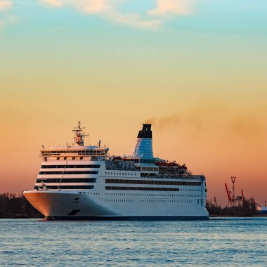 White cruise liner at sunset